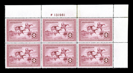 RW2, 1935 $1.00 Rose lake, top right margin plate no. F131981 block of six, well centered, strong bright color, o.g., a few h.r.s and some rejoined perfs. in the top selvage,
very fine a highly collectable example of this scarce plate block.