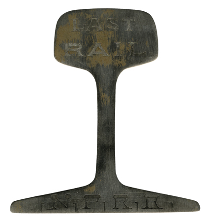 [The Last Rail in the Northern Pacific] Extremely rare souvenir of the opening of the Northern Pacific Railroad. An actual slice of the excess cut from the last rail laid to
complete the line, which connected Lake Superior to Seattle. The last sp