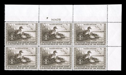 RW6, 1939 $1.00 Chocolate, full top right margin plate no. F141428 block of six, remarkably well centered, strong rich color, o.g., n.h., typical small natural gum bends and
skips, tiny indentation in the top of the margin of no importance, extr